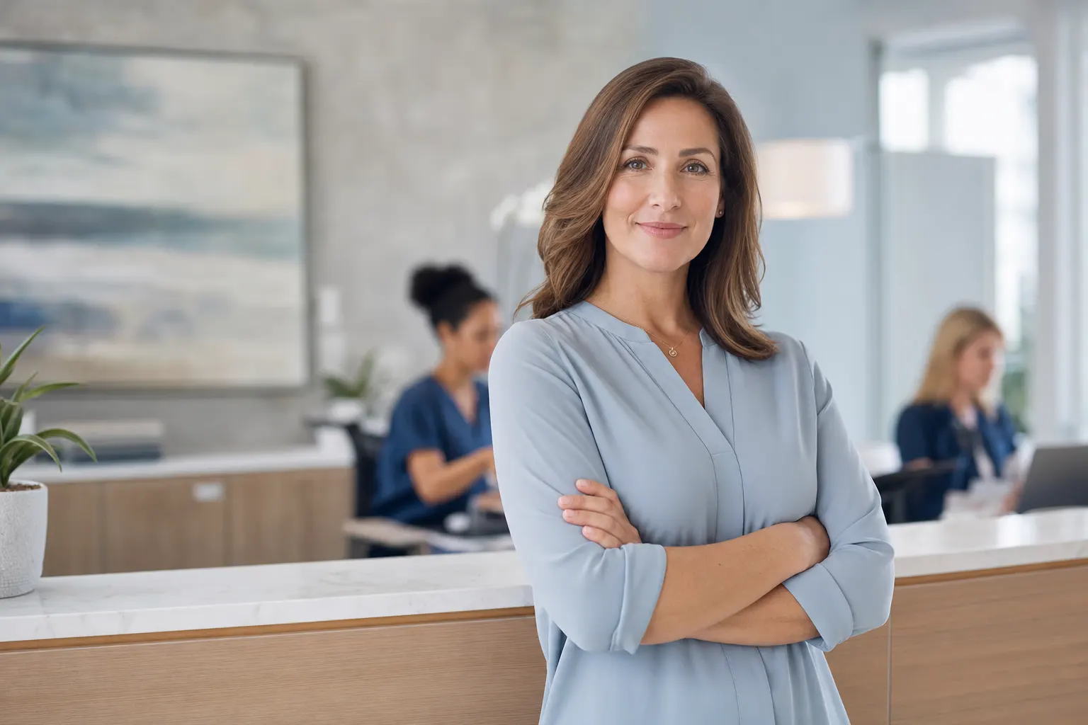 A billing specialist reviewing claims with a provider
